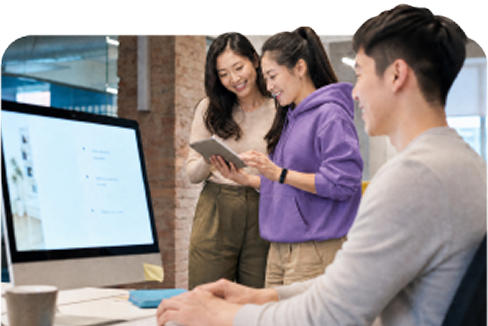 Team collaborating around a digital display